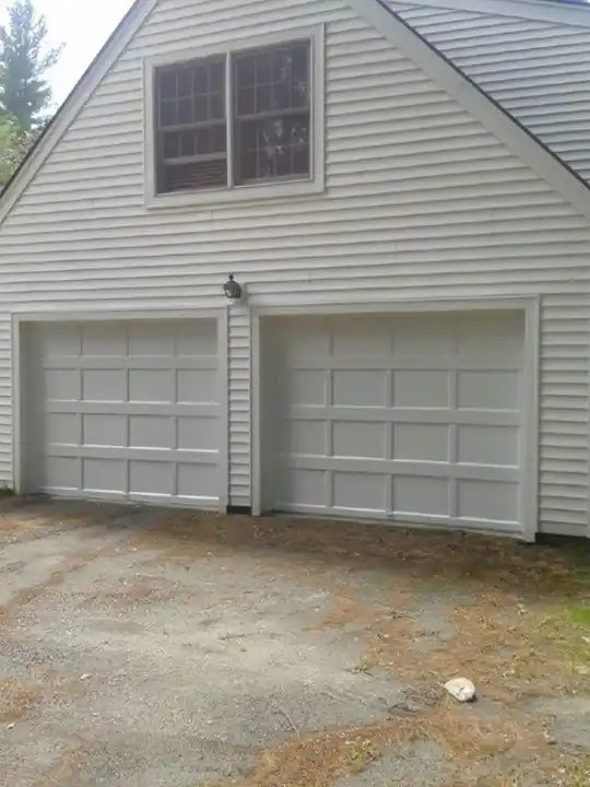 Two cream raised-panel doors under a large upper window