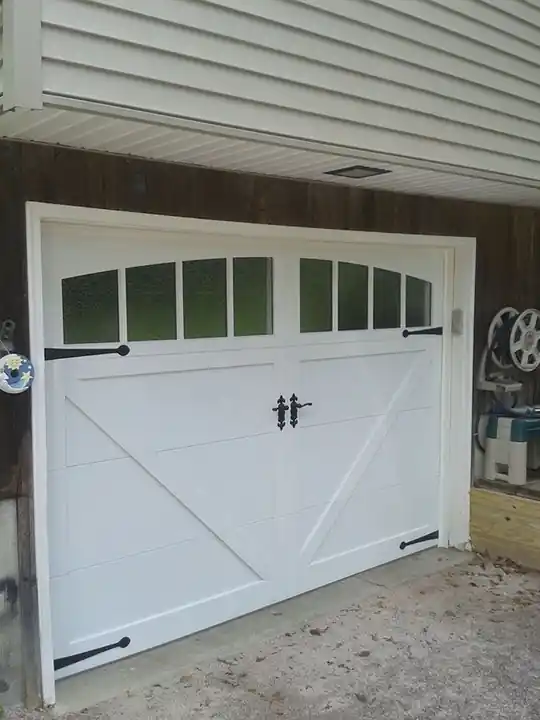 White X-brace door with frosted windows and black strap hardware